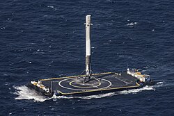 Falcon 9 first stage on an autonomous spaceport drone ship (ASDS) barge after the first successful landing at sea, SpaceX CRS-8 mission