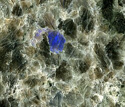 Nain Anorthosite, a mid-Mesoproterozoic intrusion (1.29 to 1.35 billion years), Labrador. Polished slab; blue color is labradorescence.