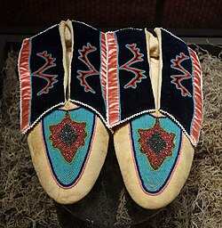 Moccasins made by Mrs. Sien-Coit Sturm (Caddo), circa 1909, collection of the Bata Shoe Museum, in Toronto, Ontario[31]