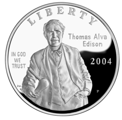 Digital rendering of the Edison silver dollar. The bust of Edison in his characteristic suit is central with the middle aged man facing forward.