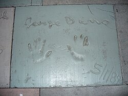 The handprints of George Burns in front of The Great Movie Ride at Walt Disney World's Disney's Hollywood Studios theme park.