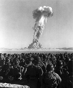 U.S. Army soldiers observing an atomic bomb test of Operation Buster-Jangle at the Nevada Test Site during the Korean War