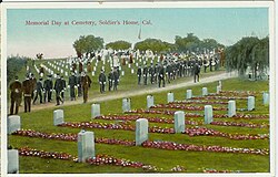 "Old soldiers" observing Memorial Day at the cemetery in the early 20th century