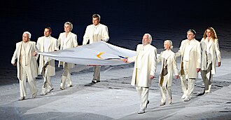 Several notable Canadians, including Sutherland (right front), carrying the Olympic flag at the 2010 Winter Olympics opening ceremony in Vancouver