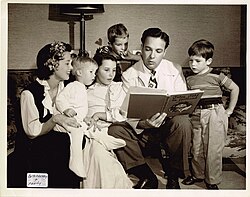 Bob Crosby reading "Tales Told in Holland" to his family.