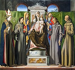 In Alvise Vivarini's painting, Anthony is distinguished from the other saints by his attributes: the book and the white lily stalk.