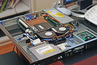 The inside and front of a Dell PowerEdge server, a computer designed to be mounted in a rack mount environment. Servers similar to this one are often used as web servers.