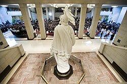 The opening ceremony of the Capitol Visitor Center with a plaster cast model of the Statue of Freedom in the foreground in December 2008