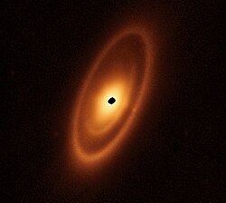 Astronomers used the James Webb Space Telescope to image the warm dust around a nearby young star, Fomalhaut, to study the first asteroid belt ever seen outside the Solar System in infrared light.[26]