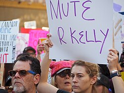 Protester at the 2019 Women's March in Los Angeles calling for a boycott of R. Kelly's music