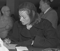 Garbo signing her US citizenship papers in February 1951