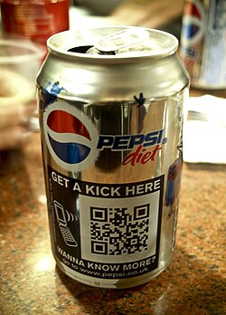 A QR code printed on the packaging of a cola can, linking directly to the Pepsi website, so the user is not required to manually enter the web address