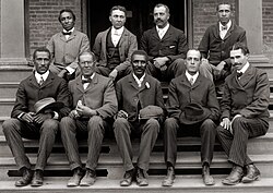 George Washington Carver (front row, center) poses with fellow faculty of Tuskegee Institute in this c. 1902 photograph taken by Frances Benjamin Johnston.