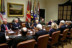 Kissinger, alongside President Barack Obama and other politicians, discussing the New START Treaty between the U.S. and Russia, 2010