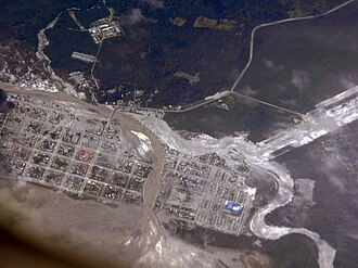 Areal view of Chaitén after the volcanic tephra filled the river bed—the river flooded and buried large parts of the town with volcanic material.