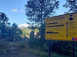 Warning sign of volcanic hazard in the surroundings of the Villarrica volcano, in Chile.