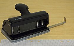 Triohålning punch and punched paper