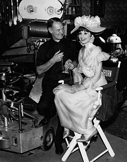 Audrey Hepburn as Eliza Doolittle on the set of 1964 film adaptation.