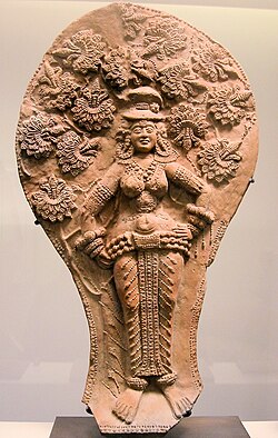 Yakshi under a flowering asoka tree. Shunga, 2nd–1st century BC, India