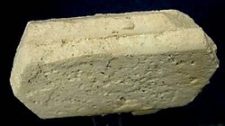 When minerals react, the products will sometimes assume the shape of the reagent; the product mineral is termed a pseudomorph of (or after) the reagent. Illustrated here is a pseudomorph of kaolinite after orthoclase. Here, the pseudomorph preserved the Carlsbad twinning common in orthoclase.