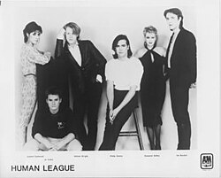 The Human League in 1984. From left to right: Joanne Catherall, Jo Callis, Wright, Oakey, Susan Ann Sulley, Ian Burden.