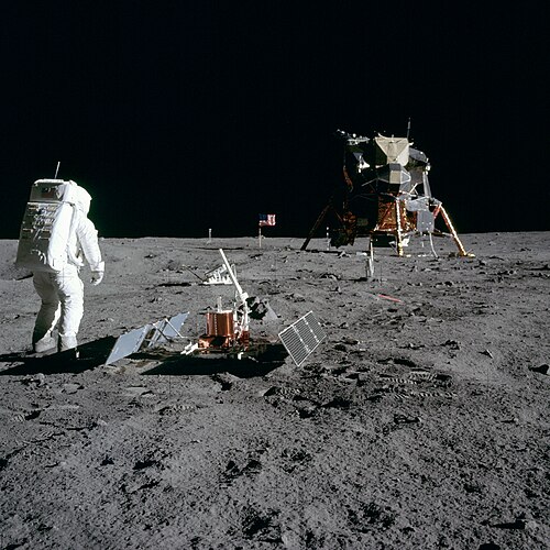 Aldrin next to the Passive Seismic Experiment Package with the Lunar Module Eagle in the background