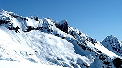 Loose snow avalanches (far left) and slab avalanches (near center) near Mount Shuksan in the North Cascades mountains. Fracture propagation is relatively limited.