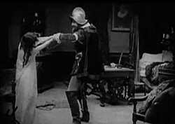 The Mercenary Soldier (Allan Sears) kills Brown Eyes (Margery Wilson).