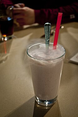 A milkshake prepared with liquid nitrogen. Nitrogen vapour can be seen emanating from the top of the glass.