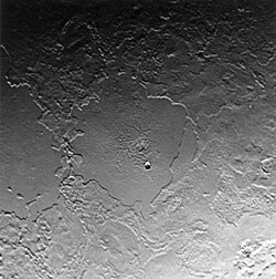 Tuonela Planitia (left) and Ruach Planitia (center) are two of Triton's cryovolcanic "walled plains". The paucity of craters is evidence of extensive, relatively recent, geologic activity.