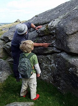 A young geologist learns about flow banding