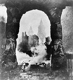 Beaton's photograph of the bell towers of St Paul's Cathedral in London, seen through an archway after an incendiary raid, 1940