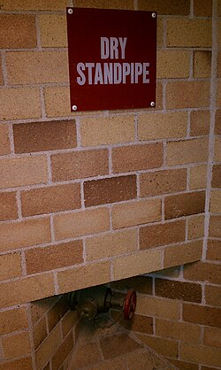 Labeled dry standpipe outlet in a university building