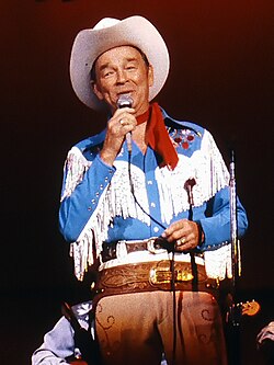 Iconic cowboy singer and actor Roy Rogers wearing Western shirt with faux pearl snaps