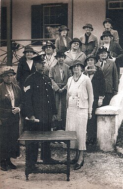 A Bermuda Police Sergeant confiscates women's suffrage activist Gladys Morrell's table in the 1930s.