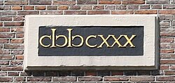 "1630" on the Westerkerk in Amsterdam. "M" and "D" are given archaic apostrophus form.