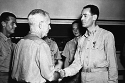 Wearing the bars of a full lieutenant, Fonda is awarded the Bronze Star.