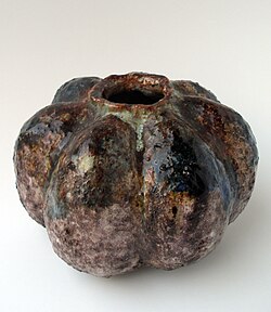 Stoneware vase modelled in an organic shape, with polychrome drip glaze. Incised signature "WHJ" Scandinavia. Ca.1932-1938. Height: 11 ½ cm. Width 15 cm. by William H. Johnson
