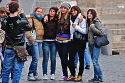 Crowd of people wearing a variety of jean styles, including carpenter jeans, bootcut jeans, drainpipe jeans and lowrise jeans (Rome, 2008)