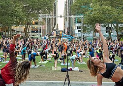 Large public yoga as exercise class in a New York City park