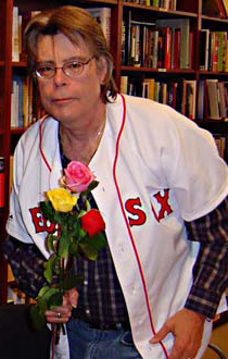 King wearing a Boston Red Sox jersey at a book signing in November 2004