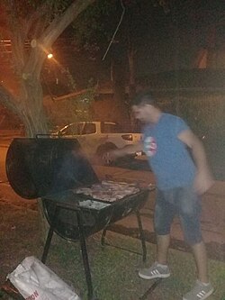 A "chulengo" is usually an oil barrel cut in half, used to protect the fire and meat from winds