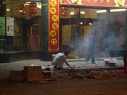 A Chinese man setting off fireworks during Chinese New Year in Shanghai