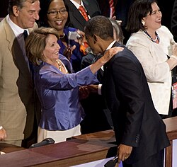 Pelosi and Barack Obama shaking hands at the 2008 Democratic National Convention