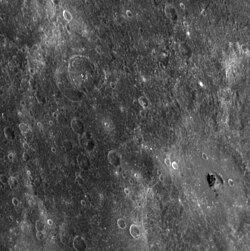 Several areas on Mercury are extremely dark, such as a small crater within Hemingway crater in the lower right.