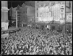 Before radio became common: a crowd watches as election results are posted on the front of the Evening Post building
