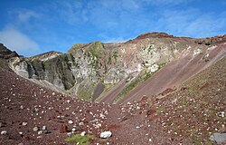 Crumbling scoria cliffs surround the summit rift