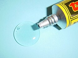 Nitrocellulose adhesive dispensed from a tube