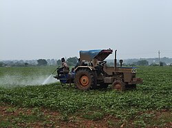 Spraying pesticides on fields to protect the crops from pests.