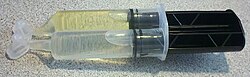 A syringe of "5-minute" epoxy glue, containing separate compartments for the epoxy resin and the hardener